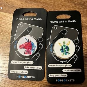 Two brand new pop sockets